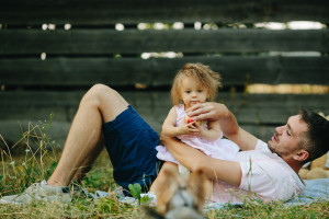 Happy family on lawn in the park